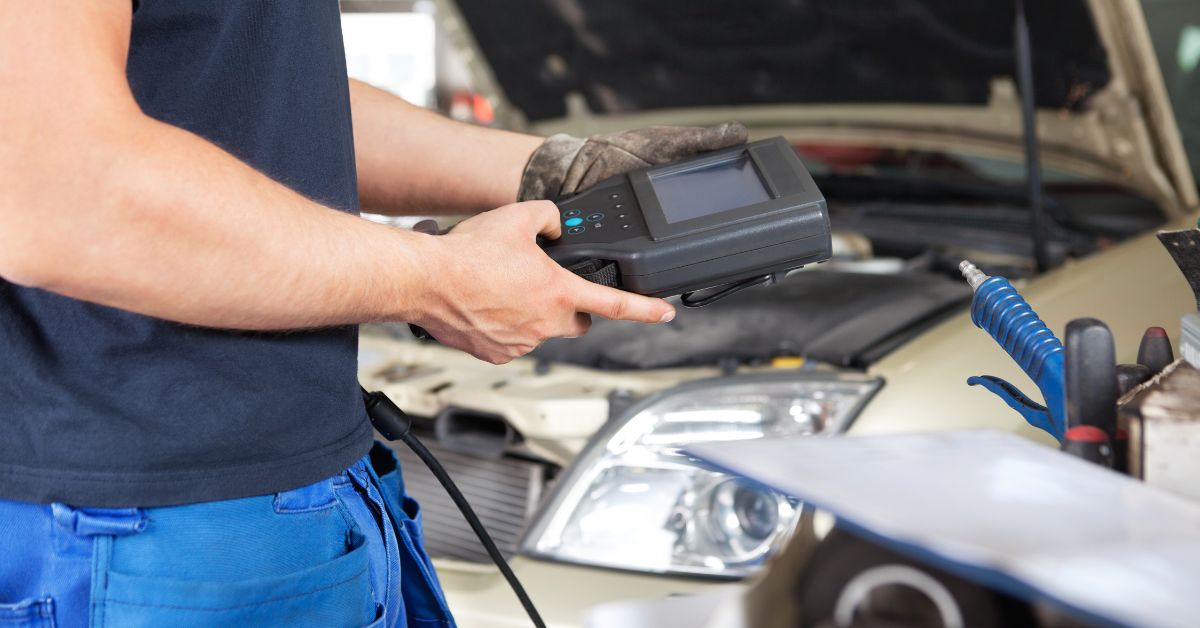 mechanic operating a diagnostic tools